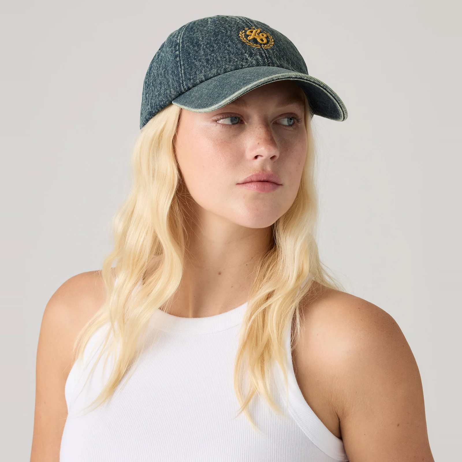 W'S VARSITY BASEBALL CAP LAID IN THE MEA